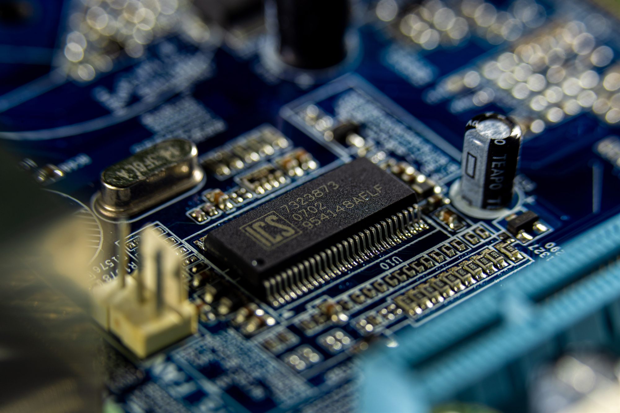 Close-up of a populated circuit board showing integrated circuits and passive components